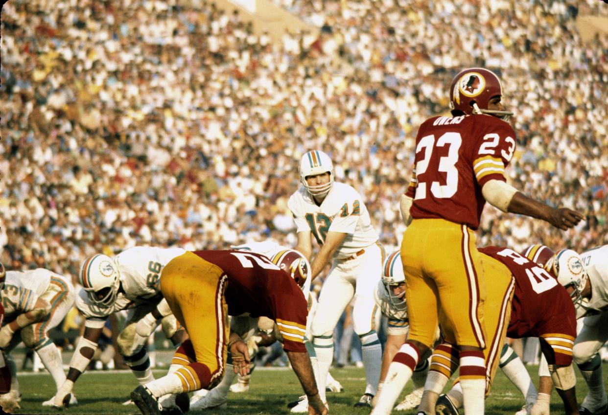 Miami Dolphins Hall of Fame quarterback Bob Griese calls signals and awaits the snap in a 14-7 win over the Washington Redskins in Super Bowl VII on January 14, 1973 at Los Angeles Memorial Coliseum in Los Angeles, California.