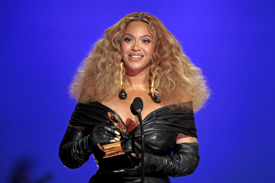 beyonce is holding a grammy award