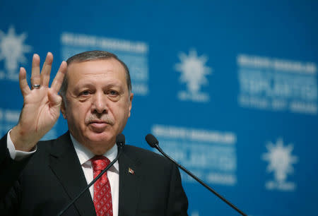 Turkish President Tayyip Erdogan greets mayors from his ruling AK Party during a meeting at the Presidential Palace in Ankara, Turkey, September 13, 2017. Yasin Bulbul/Presidential Palace/Handout via REUTERS