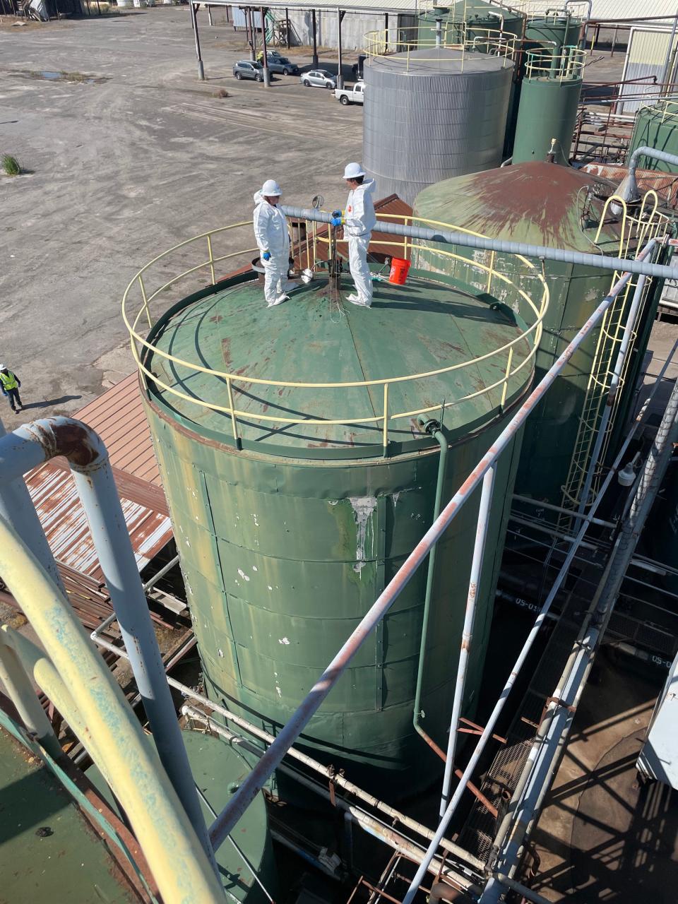 Environmental Protection Agency employees work at the J H Baxter & Co. plant in west Eugene.