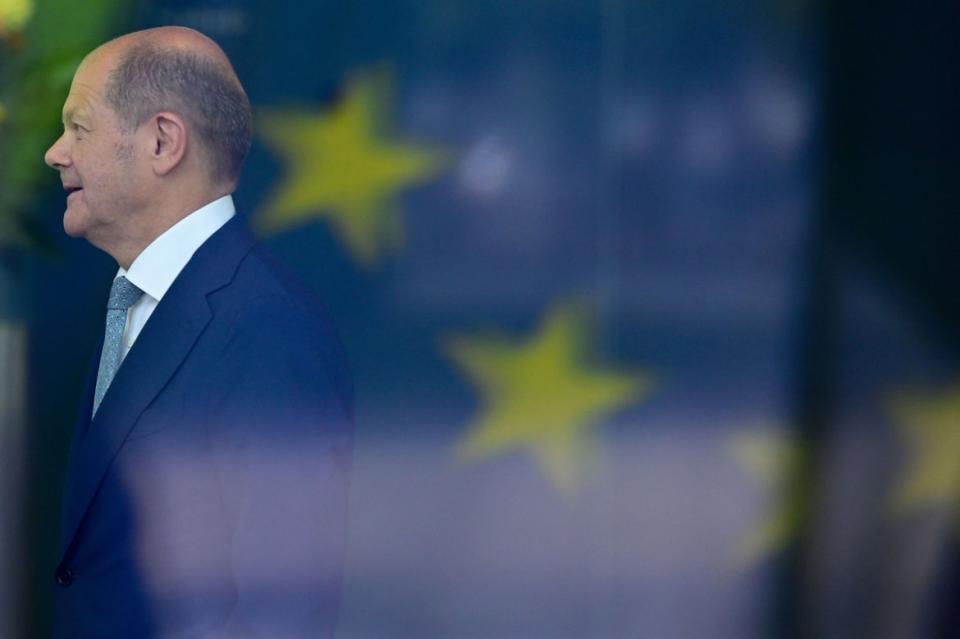 <div class="inline-image__caption"> <p>German Chancellor Olaf Scholz is pictured behind the reflection of an EU flag on the window of the Chancellery as he awaits for the arrival of Bulgaria's President ahead of their meeting in Berlin, Germany, on May 16, 2022. </p> </div> <div class="inline-image__credit"> (Photo by John MACDOUGALL/AFP via Getty Images) </div>