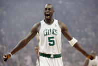 FILE - In this May 6, 2008, file photo, Boston Celtics' Kevin Garnett gestures to the crowd just before tipoff in Game 1 of an NBA Eastern Conference semifinal basketball series against the Cleveland Cavaliers in Boston. Kobe Bryant, Tim Duncan and Kevin Garnett. Each was an NBA champion, an MVP, an Olympic gold medalist, annual locks for All-Star and All-Defensive teams. And now, the ultimate honor comes their way: On Saturday night, May 15, 2021, in Uncasville, Connecticut, they all officially become members of the Naismith Memorial Basketball Hall of Fame.(AP Photo/Winslow Townson, File)