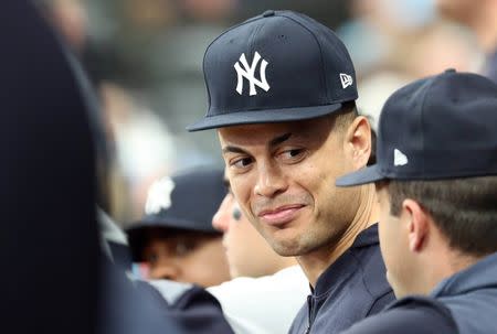 May 11, 2019; St. Petersburg, FL, USA; New York Yankees outfielder Giancarlo Stanton (27) looks on from the dugout against the Tampa Bay Rays at Tropicana Field. Mandatory Credit: Kim Klement-USA TODAY Sports