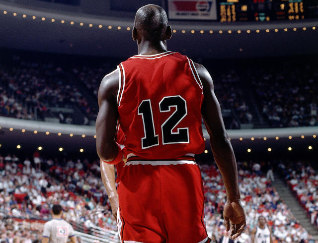 Michael Jordan's jersey is pulled to the rafters during Michael