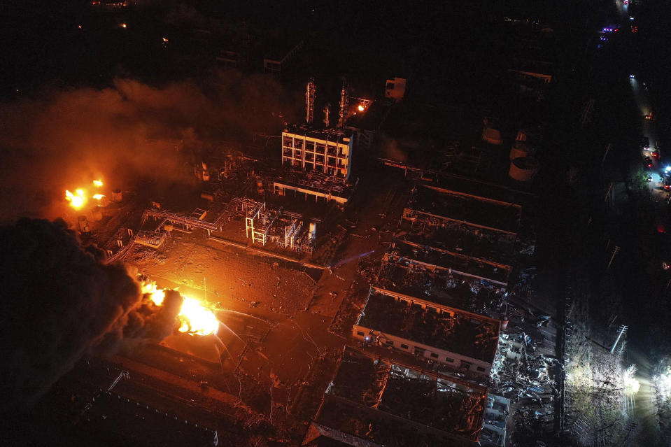 In this Thursday, March 21, 2019, aerial photo released by China's Xinhua News Agency, fires burn at the site of a factory explosion in a chemical industrial park in Xiangshui County of Yancheng in eastern China's Jiangsu province. The local government reports the death toll in an explosion at a chemical plant in eastern China has risen with dozens killed and more seriously injured. (Ji Chunpeng/Xinhua via AP)