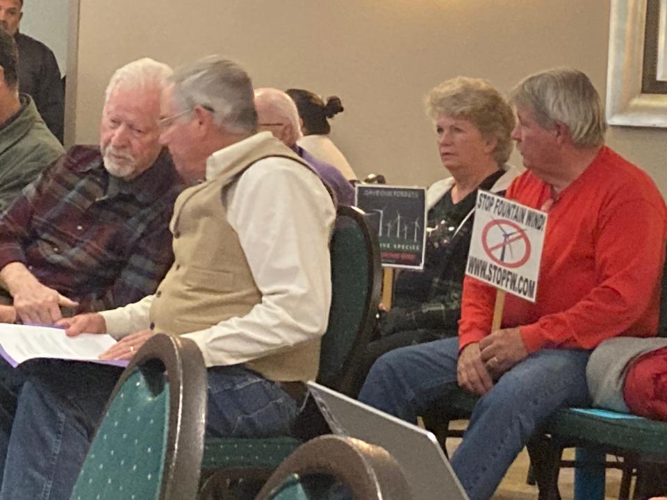 Some residents showed up to the Tuesday, Nov. 28, 2023, Fountain Wind meeting with signs opposing the project.