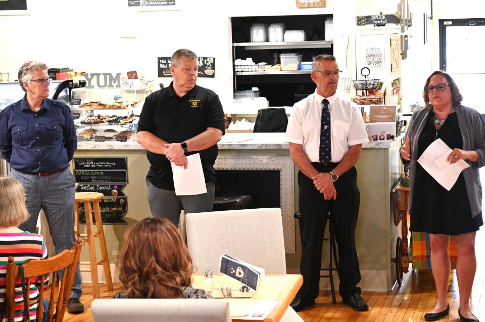 Sheriff candidates Robin Swartz, Fred Blakenship, and Mike Thyng with Kim Hemker, executive director of the Branch County Coalition Against Domestic and Sexual Violence, at the Hope Cafe presentation on May 16.