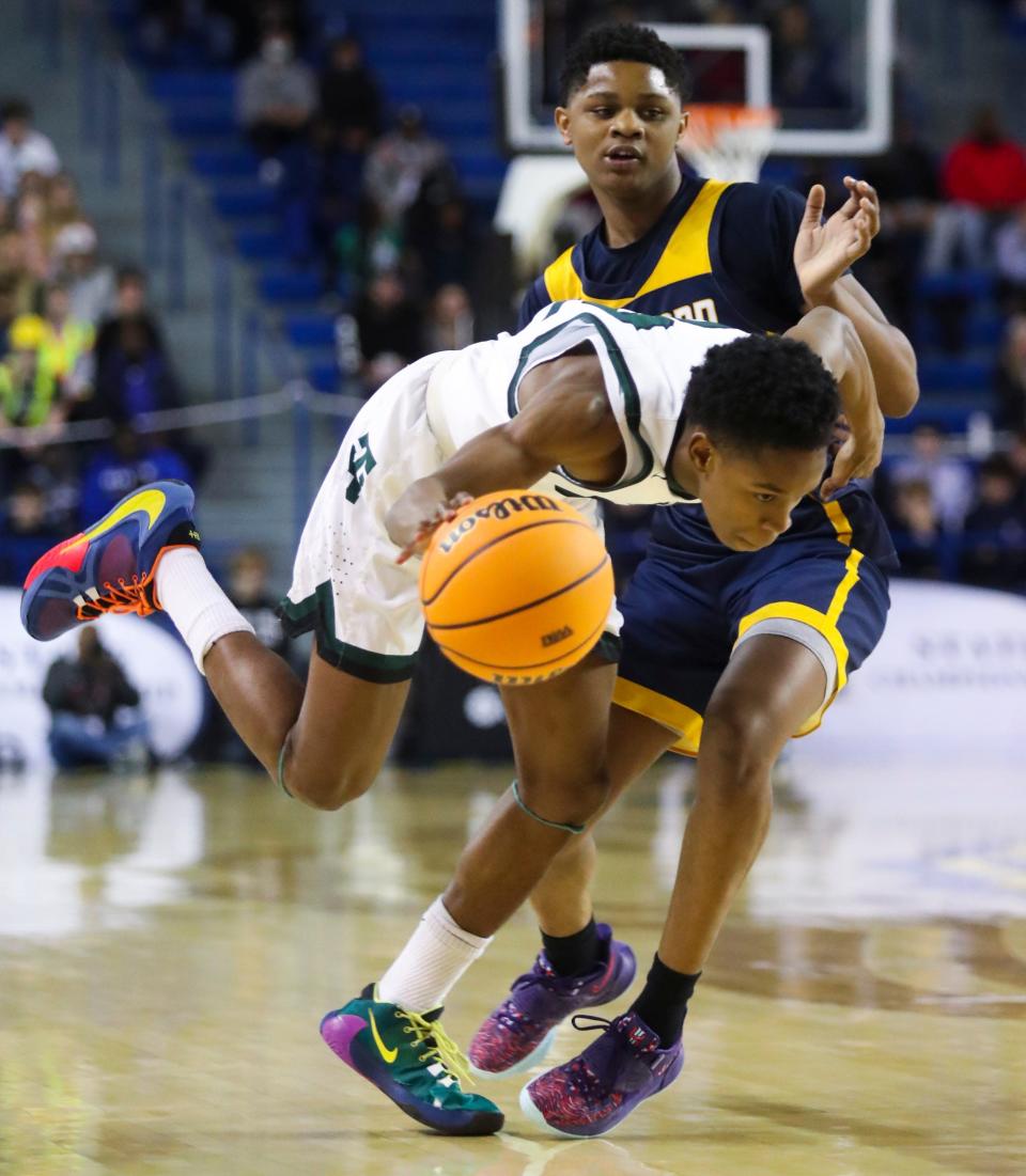 Tower Hill&#39;s Dylan Shepherd (front) tries to drive past Seaford&#39;s Kashmier Wise in the first half of a DIAA state tournament semifinal at the Bob Carpenter Center Thursday, March 10, 2022.