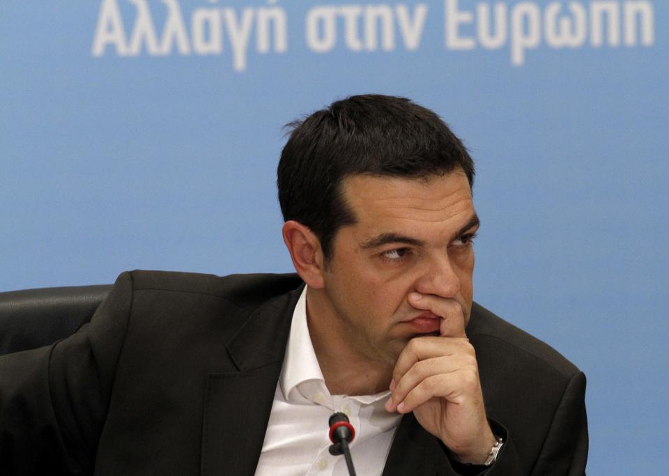 Head of Greece's Radical Left Coalition Alexis Tsipras listens in Athens, Tuesday, June 12, 2012. Tsipras, whose party came a surprise second in inconclusive May 6 elections, said he would stick to his pledge to tear up Greece's bailout deal, saying the austerity the country has been forced to impose in return for billions of euros in rescue loans was leading Greece towards collapse. (AP Photo/Petros Karadjias)