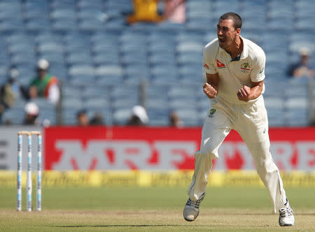 Cricket - India v Australia - First Test cricket match - Maharashtra Cricket Association Stadium, Pune, India - 24/02/17. Australia's Mitchell Starc celebrates the wicket of India's captain Virat Kohli. REUTERS/Danish Siddiqui