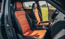 <p>Our loaded test vehicle wore flashy black and orange two-tone leather upholstery and sported a large infotainment display in the dash.</p>