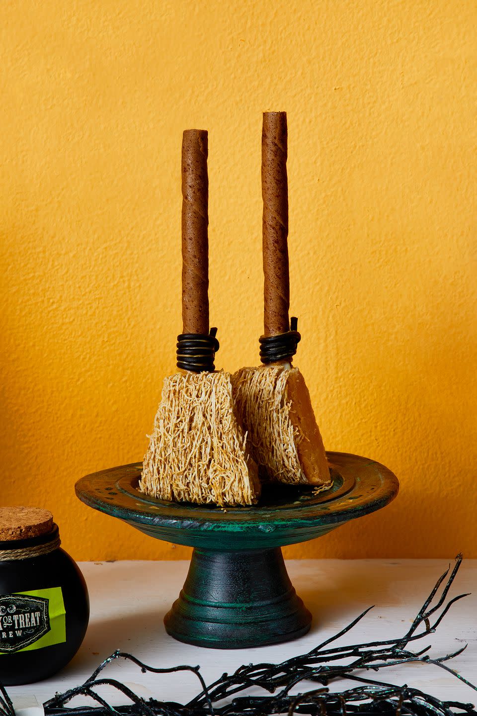 <p>Boost your Halloween table's visual appeal with these mini fudge broomsticks that are almost too cute to eat. </p><p><a class="link " href="https://go.redirectingat.com?id=74968X1596630&url=https%3A%2F%2Fwww.walmart.com%2Fip%2FHERSHEY-S-Hot-Fudge-Topping-Baking-Supplies-12-8-oz-Jar%2F20702794&sref=https%3A%2F%2Fwww.goodhousekeeping.com%2Fholidays%2Fhalloween-ideas%2Fg33437890%2Fhalloween-table-decorations-centerpieces%2F" rel="nofollow noopener" target="_blank" data-ylk="slk:SHOP FUDGE;elm:context_link;itc:0;sec:content-canvas">SHOP FUDGE</a></p>