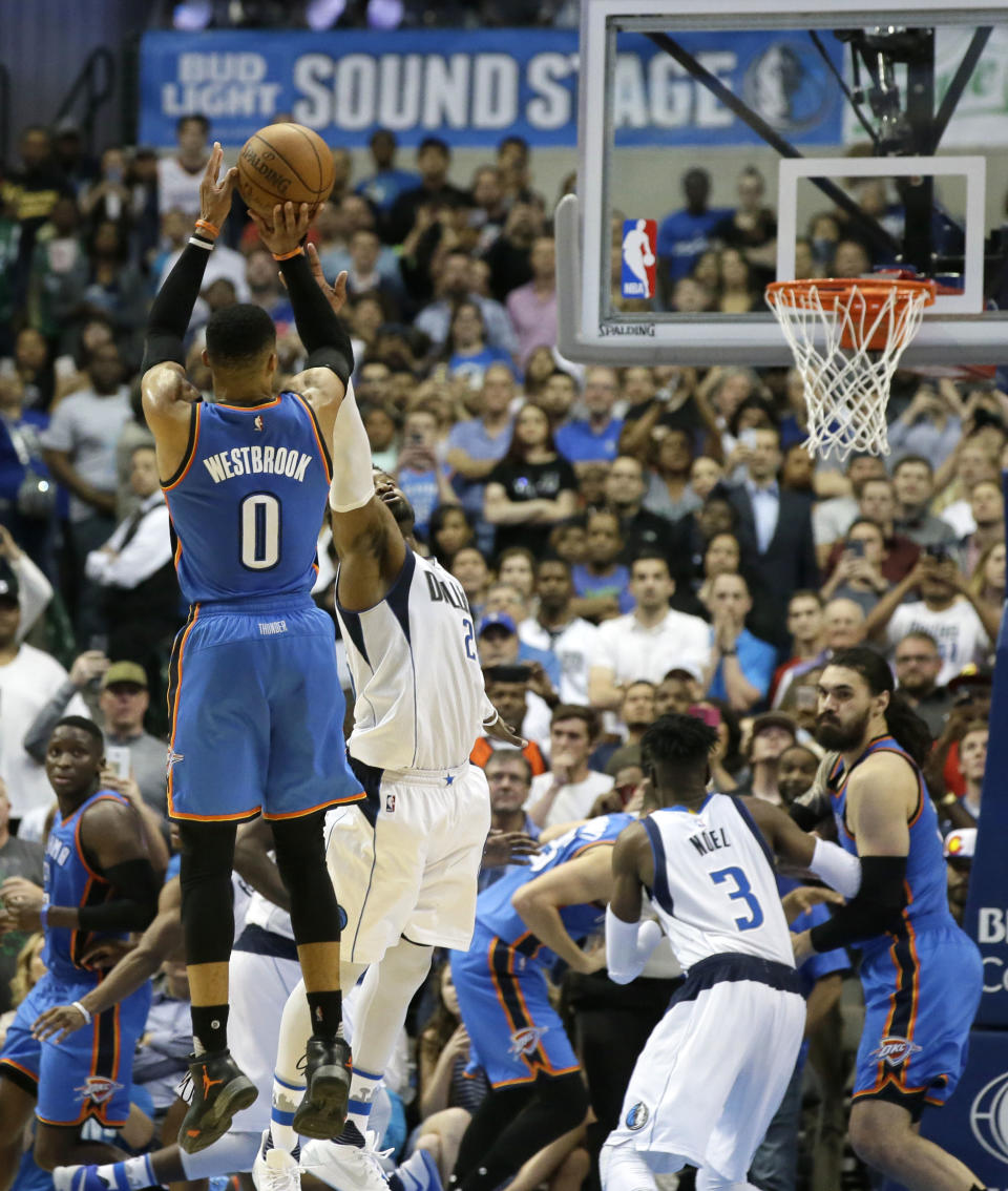 Oklahoma City Thunder guard Russell Westbrook (0) takes his last shot of the game during the second half of an NBA basketball game against the Dallas Mavericks in Dallas, Monday, March 27, 2017. The Thunder won 92-91. (AP Photo/LM Otero)