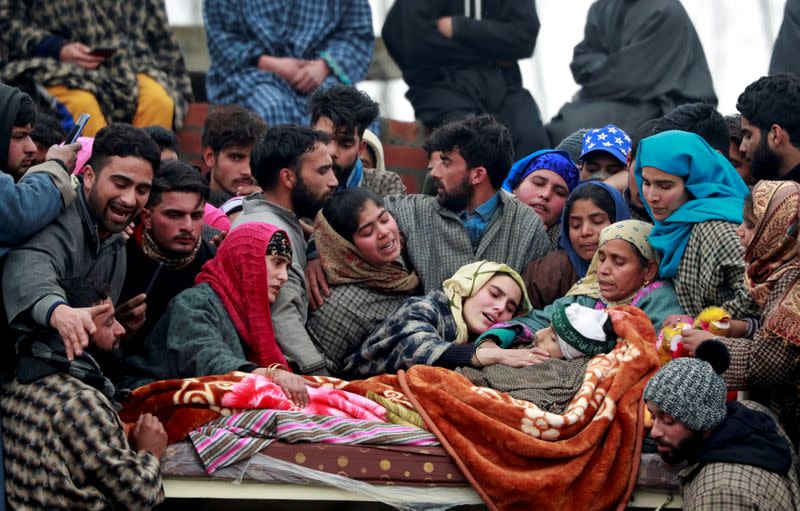 FILE PHOTO: People surround the body of Adil Ahmad Dar during his funeral in Arwani