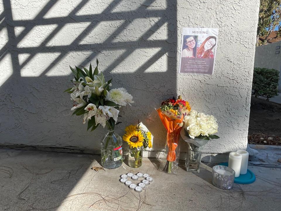 A small makeshift memorial sits beneath a missing person poster two days after Rachel Castillo's estranged husband was arrested on murder charges. Castillo lived in Simi Valley and was reported missing Nov. 10.