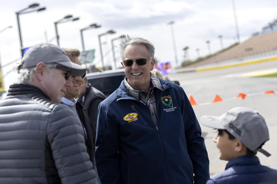 FILE - Nevada Gov. Joe Lombardo greets fans before the Pennzoil 400 NASCAR Cup Series auto race, on March 5, 2023, in Las Vegas. As a slate of bills from the Democratic-controlled Nevada Legislature edges closer to Gov. Joe Lombardo's desk, little is known about how the Republican governor will use his veto power in one of the country's 10 remaining state governments where Democrats control one branch and Republicans control the other. (AP Photo/Ellen Schmidt, File)