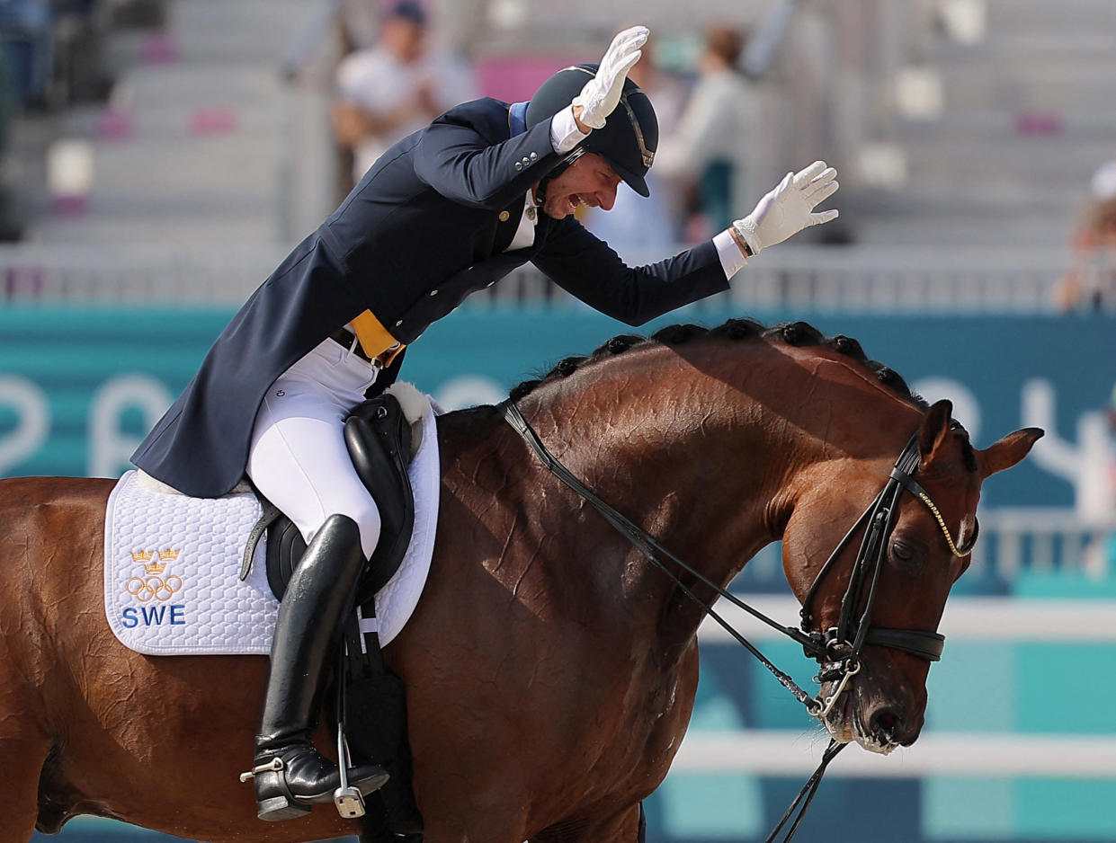 Patrik Kittel of Sweden, riding Touchdown, reacts after competing in the dressage individual Grand Prix freestyle in Versailles, France, on Saturday.