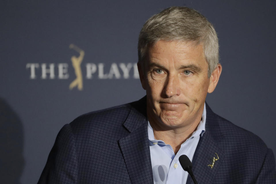 FILE - In this March 13, 2020 file photo, PGA Tour Commissioner Jay Monahan reacts to a question during a news conference at The Players Championship golf tournament, in Ponte Vedra Beach, Fla. After a three-month shutdown because of the COVID-19 pandemic, the tour has staged 36 events in 39 weeks without interruption. (AP Photo/Chris O'Meara, File)