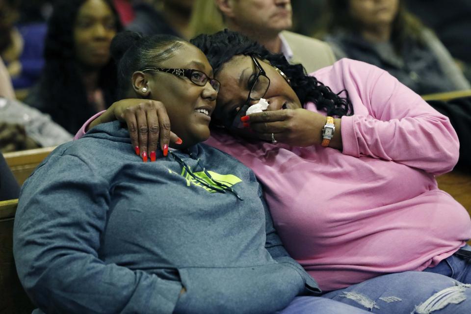 Crystal Ghoston, left, and a relative are all smiles Monday, Dec. 16, 2019 after a Mississippi circuit judge ordered bail for Curtis Flowers, Ghoston's father, whose murder conviction was overturned by the U.S. Supreme Court for racial bias was granted bond Monday and will be free for the first time in 22 years, following a hearing in Winona, Miss. (AP Photo/Rogelio V. Solis)