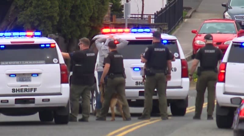 A woman suspected in a carjacking in Hazel Dell is taken into custody by Clark Couty deputies, April 13, 2024 (KOIN)