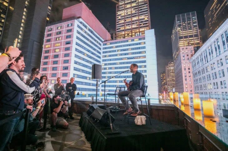 <span class="article__caption">Jack Johnson performs at a private rooftop concert during the NFT.NYC conference. The show gave conference-goers a small taste of the benefits they can expect from the Outerverse Passport. (Photo: Darren Miller)</span>