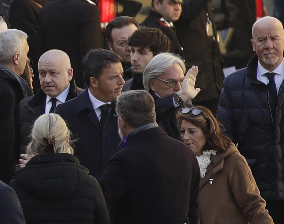 <p>Former premier and Democratic Party president Matteo Renzi, center, arrives with Fiorentina owner Diego Della Valle, for the funeral ceremony of Italian player Davide Astori in Florence, Italy, Thursday, March 8, 2018. The 31-year-old Astori was found dead in his hotel room on Sunday after a suspected cardiac arrest before his team was set to play an Italian league match at Udinese. (AP Photo/Alessandra Tarantino) </p>