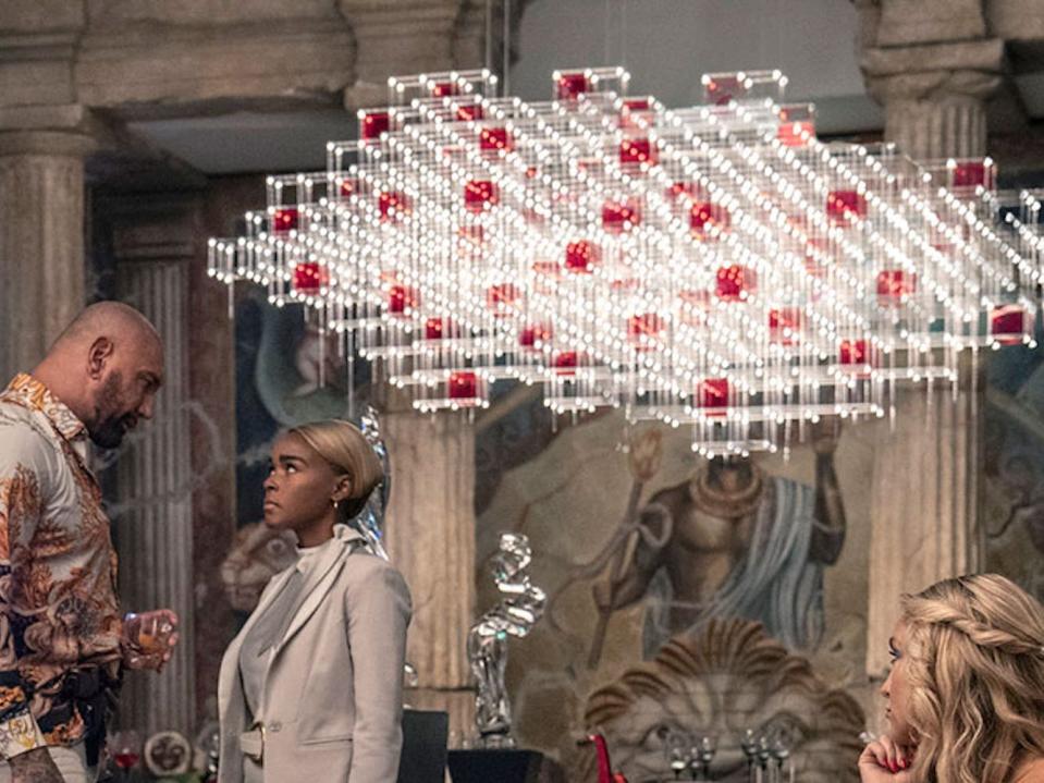 Dave Bautista as Duke Cody and Janelle Monae as Andi Brand under the Hydrogen fuel shaped-light.