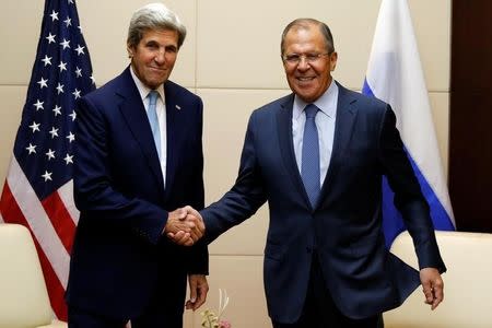 U.S. Secretary of State John Kerry (L) greets Russia's foreign minister Sergey Lavrov during a bilateral meeting at the sidelines of the ASEAN foreign ministers meeting in Vientiane, Laos July 26, 2016. REUTERS/Jorge Silva