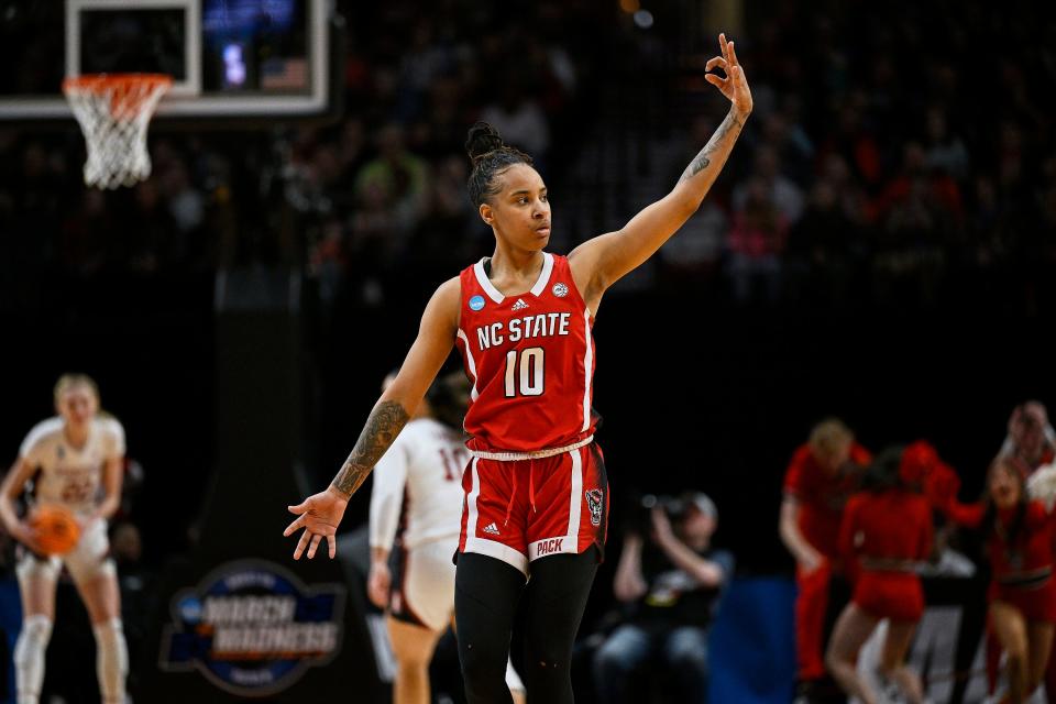 NC State's Aziaha James (10) celebrates after making a 3-pointer against Stanford in the semifinals of the Portland Regional of the 2024 NCAA Tournament March 29 in Portland, Ore.