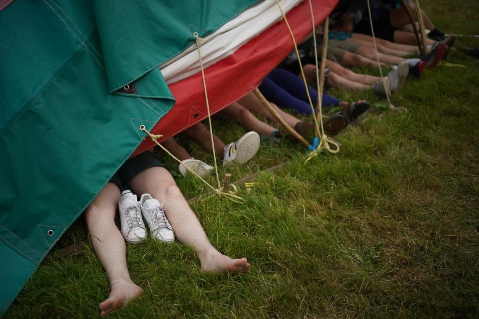 Revellers may be forced to take shelter if storm clouds gather as expected (Yui Mok/PA) (PA Wire)