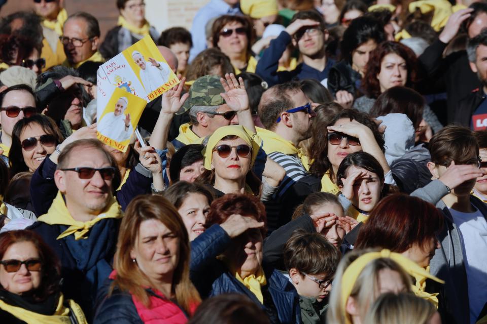 Faithful wait for Pope Francis to arrive at the Catholic Shrine of Our Lady of Loreto in central Italy for a one-day visit, Monday, March 25, 2019. The pope chose Loreto to sign the Post-Synodal Exhortation of last October's Synod of Bishops. (AP Photo/Domenico Stinellis)