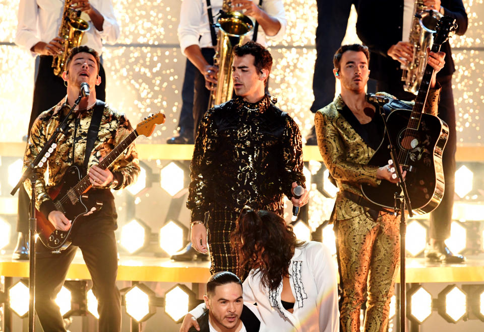 LOS ANGELES, CALIFORNIA - JANUARY 26: (L-R) Nick Jonas, Joe Jonas, and Kevin Jonas of music group Jonas Brothers perform onstage during the 62nd Annual GRAMMY Awards at STAPLES Center on January 26, 2020 in Los Angeles, California. (Photo by Kevin Winter/Getty Images for The Recording Academy )