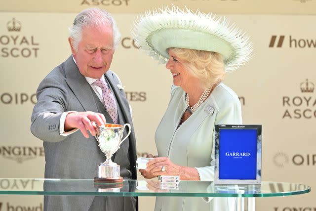 <p>Samir Hussein/WireImage</p> King Charles and Queen Camilla attend the 2023 Royal Ascot.