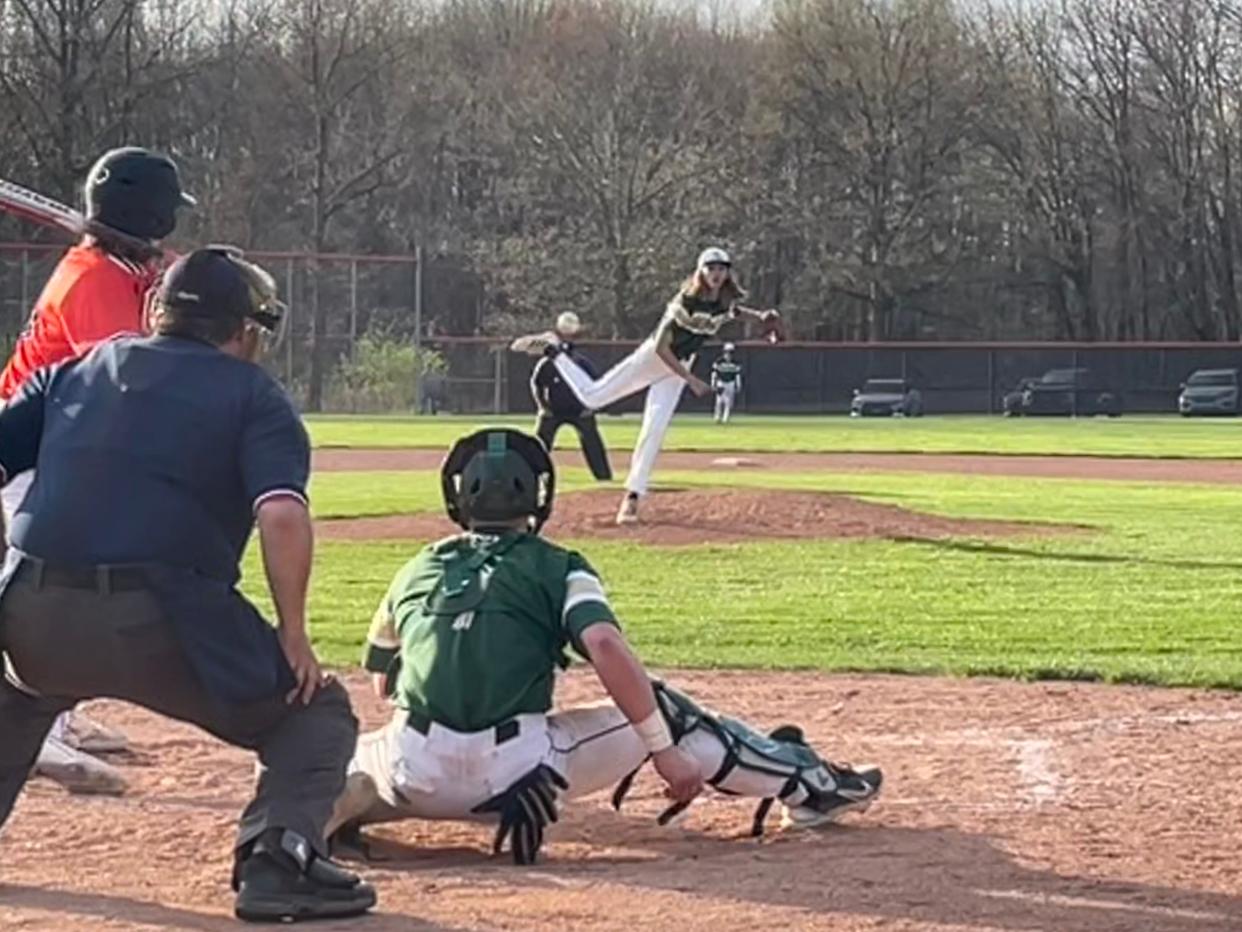 GlenOak's Johnathan Birchler delivers a pitch to catcher Gavin McCaulley as Green's Jacob Harrelson bats during a high school baseball game at Green on Tuesday, April 16, 2024.