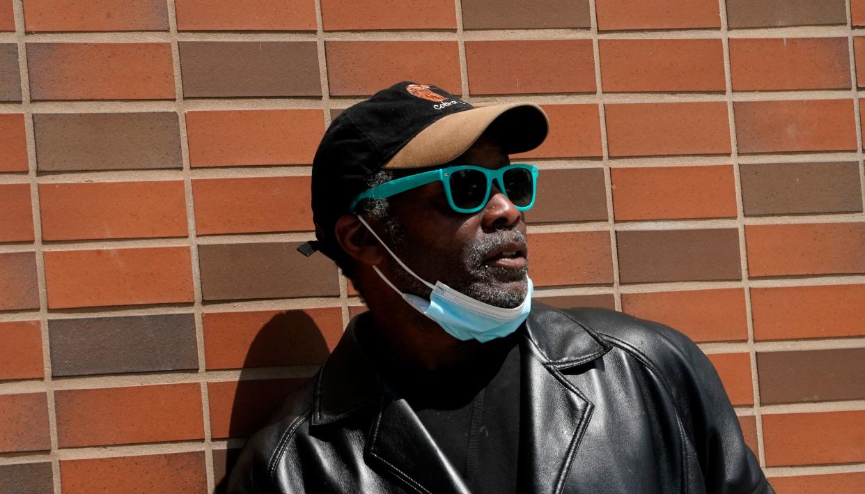 People walk on a street in Harlem April 27, 2012, as the US Centers for Disease Control and Prevention (CDC) issued new guidance on outdoor mask use for fully vaccinated Americans. - The CDC notified fully vaccinated Americans that they can go mask-free most of the time outdoors. (Photo by TIMOTHY A. CLARY / AFP) (Photo by TIMOTHY A. CLARY/AFP via Getty Images)