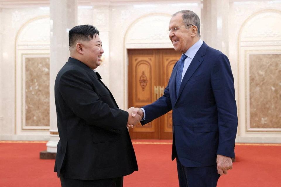 North Korean leader Kim Jong-un shakes hands with Russian foreign minister Sergei Lavrov during a meeting in Pyongyang (via REUTERS)