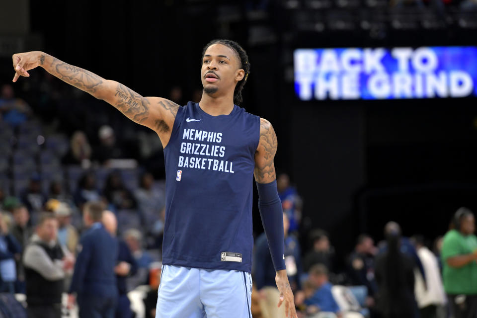 Memphis Grizzlies guard Ja Morant warms up before an NBA basketball game against the Indiana Pacers, Thursday, Dec. 21, 2023, in Memphis, Tenn. (AP Photo/Brandon Dill)