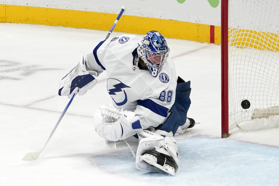 Tampa Bay Lightning goaltender Andrei Vasilevskiy is scored on by Anaheim Ducks center Derek Grant during the first period of an NHL hockey game Friday, Jan. 21, 2022, in Anaheim, Calif. (AP Photo/Mark J. Terrill)