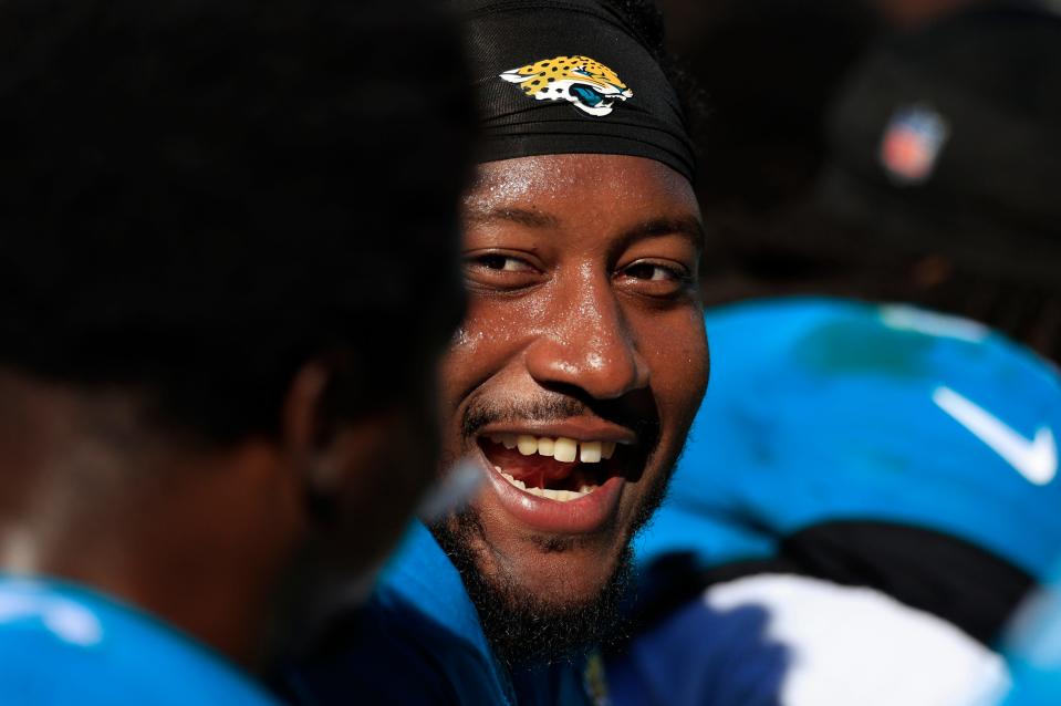 Jacksonville Jaguars defensive tackle DaVon Hamilton (52) smiles on the bench during the second quarter of a regular season NFL football matchup Sunday, Dec. 31, 2023 at EverBank Stadium in Jacksonville, Fla. The Jacksonville Jaguars blanked the Carolina Panthers 26-0. [Corey Perrine/Florida Times-Union]