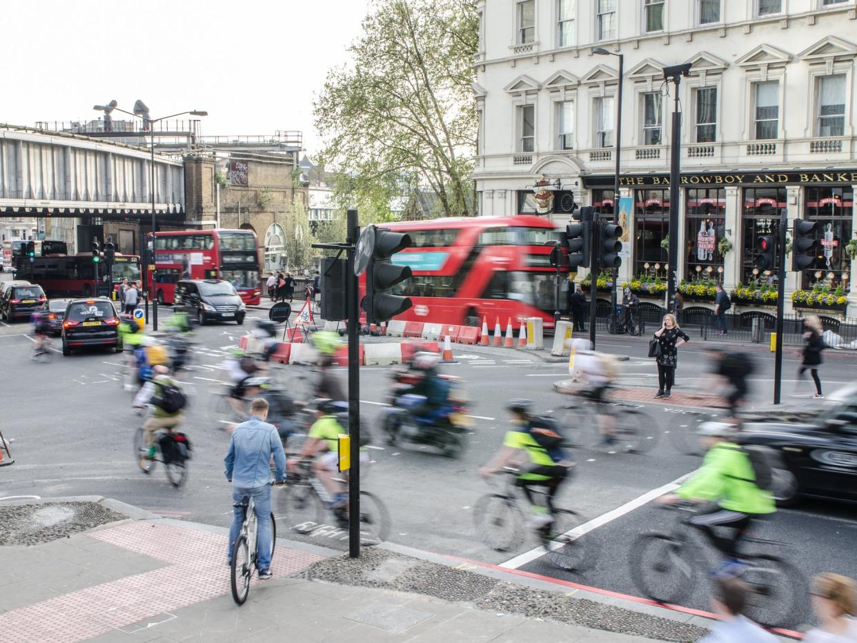 Cyclists at London Bridge before coronavirus. The government wants to make public transport and active travel 'the natural first choice' for journeys: Getty