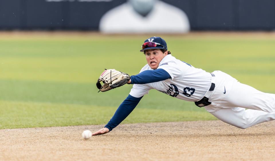 BYU freshman Chad Call attempts to field a grounder at Miller Park in Provo. Call is following in the footsteps of his father Burt, who also played baseball for the Cougars. | Matthew Norton, BYU Photo