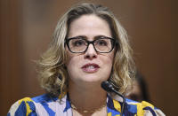 FILE - Sen. Kyrsten Sinema, D-Ariz., speaks during a Senate Finance Committee hearing Oct. 19, 2021 on Capitol Hill in Washington. Sinema received a $1 million surge of campaign cash over the past year from private equity professionals, hedge funds and venture capitalists whose interests she has staunchly defended in Congress. That's according to an Associated Press review of campaign finance disclosures.(Mandel Ngan/Pool via AP, File)