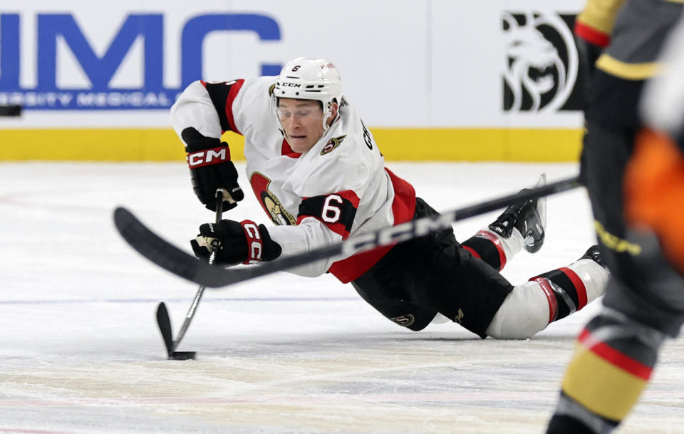 Ottawa Senators defenseman Jakob Chychrun (6) dives for the puck during the first period of an NHL hockey game against the Vegas Golden Knights, Sunday, Dec. 17, 2023, in Las Vegas. (AP Photo/Steve Marcus)