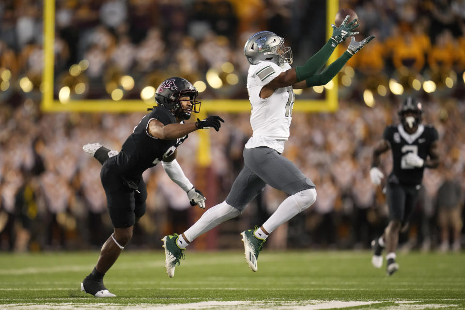 Eastern Michigan defensive back Cameron Smith breaks up a pass intended for Minnesota wide receiver Daniel Jackson, left, during the first half of an NCAA college football game Saturday, Sept. 9, 2023, in Minneapolis. Smith would be called for pass interference on the play. (AP Photo/Abbie Parr)