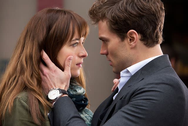 <p>Moviestore/Shutterstock</p> Dakota Johnson, Jamie Dornan in 'Fifty Shades Of Grey.'