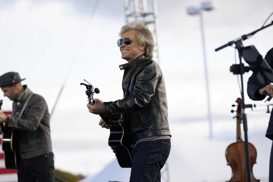 Musician Jon Bon Jovi performs at a campaign event for Democratic presidential candidate former Vice President Joe Biden at Dallas High School in Dallas, Pa., Saturday, Oct. 24, 2020. (AP Photo/Andrew Harnik)