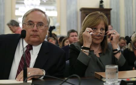 General Motors Chief Executive Mary Barra (R) and the company's general counsel Michael Millikin appear before the Senate Commerce, Science and Transportation Subcommittee in Washington July 17, 2014. REUTERS/Gary Cameron