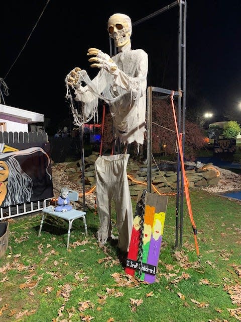 A tall skull awaits those who dare to enter The Windmill's haunted mini-golf in Hopewell.
