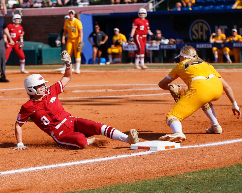 Arkansas Razorbacks outfielder KB Sides (8) slides into third base as they play against the Missouri Tigers at Katie Seashole Pressly Stadium at the University of Florida in Gainesville, FL on Saturday, May 14, 2022. [Gabriella Whisler/Special to the Sun]