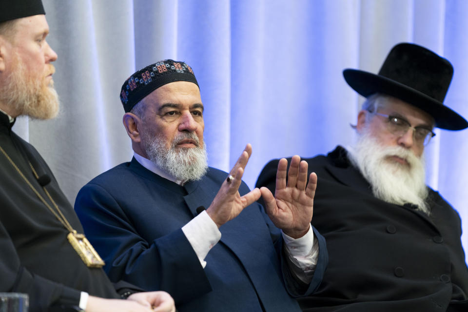 Mufti Akhmed Tamim, center, speaks during a panel discussion among an interfaith delegation of Ukrainian religious leaders including archbishop Yevstratiy Zorya, left, and Rabbi Yaakov Dov Bleich, right, on Monday, Oct. 30, 2023, at the U.S. Institute of Peace in Washington. (AP Photo/Stephanie Scarbrough)
